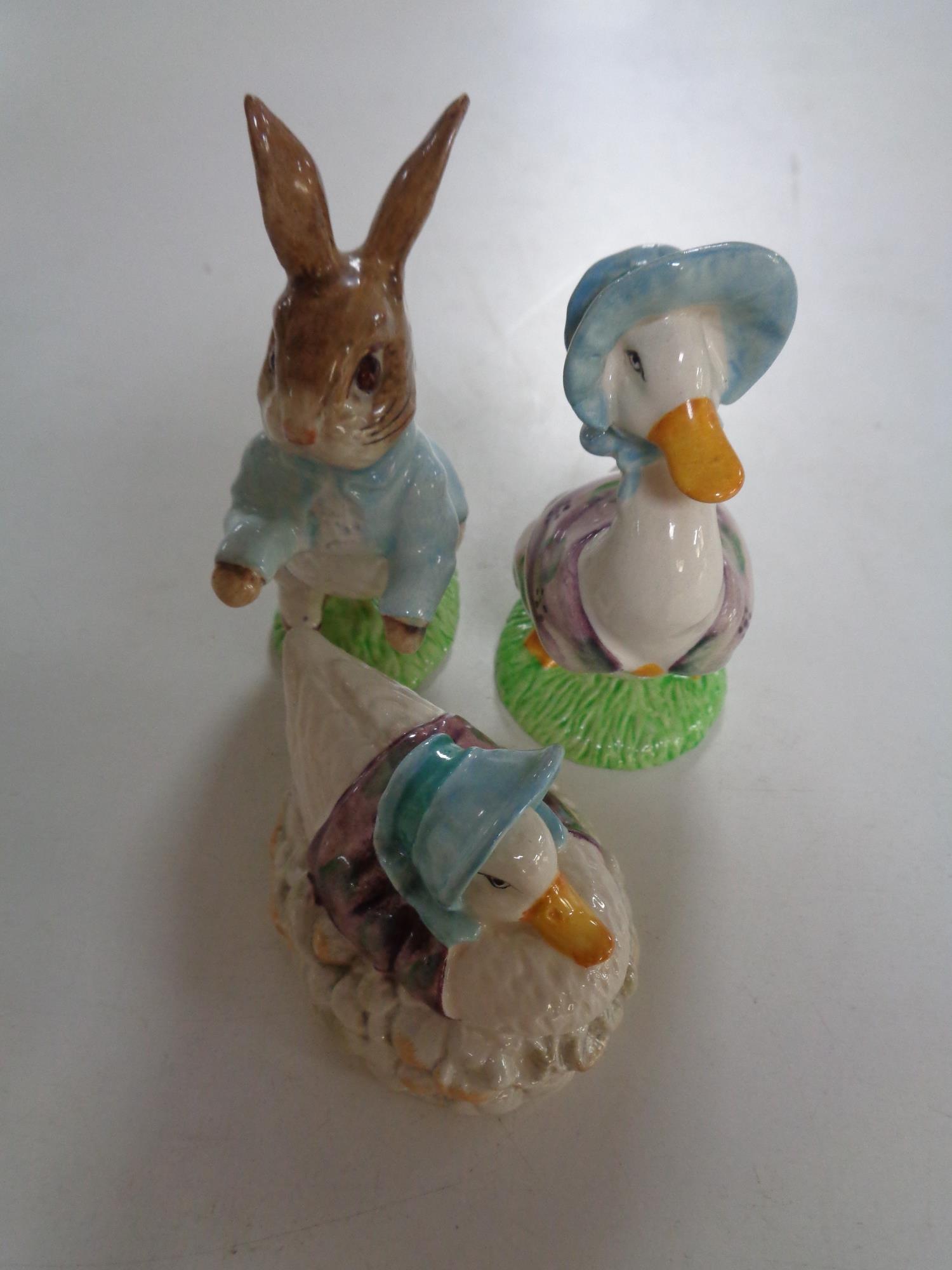 Three Beswick Beatrix Potter figures;