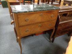 A French inlaid two drawer marble top chest on raised legs
