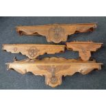 Four 20th century German Third Reich style oak doorway pediments bearing finely carved Wehrmacht