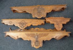 Four 20th century German Third Reich style oak doorway pediments bearing finely carved Wehrmacht