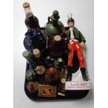 A tray of quantity of whisky and cider decanters, whisky miniatures,