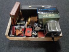 A crate of lingua phone set, wireless headphones, vintage games, harmonica,