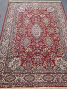 A machined Persian design rug 176 cm x 240 cm.
