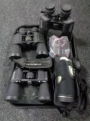 A tray of spotting scope and four pairs of binoculars to include Celestron