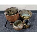 A tray of antique brass and copper ware, jam pans,