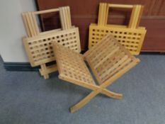 A lattice teak magazine rack together with two similar teak folding tables