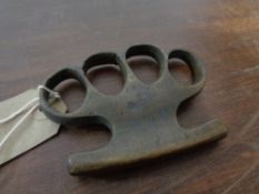 An early 20th century knuckle duster