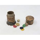 An antique treen box containing gaming counters and dice,