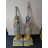 Two Dyson DC01 upright vacuums