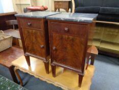 A pair of early 20th century mahogany marble topped bedside cabinets, height 73 cm, width 40 cm,