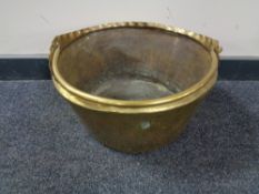 An antique brass jam pan