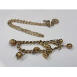 A heavy gilt metal charm bracelet, together with a gilt necklace.