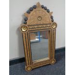 An early 20th century oak and parcel gilt framed mirror
