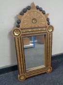 An early 20th century oak and parcel gilt framed mirror