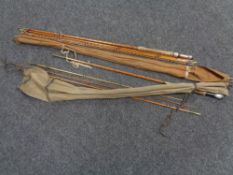 A four piece vintage split cane fly rod in carry bag together with a further three piece split cane