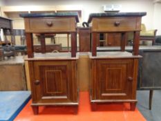 A pair of antique inlaid mahogany marble topped bedside stands