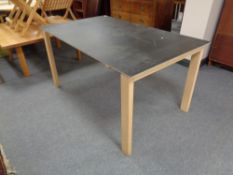 A contemporary dining table on pine legs