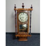 A 19th century marquetry inlaid drop dial eight day wall clock with pendulum and key