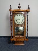 A 19th century marquetry inlaid drop dial eight day wall clock with pendulum and key