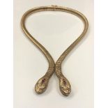 A 9ct gold two-headed snake necklace, elastic body with tongue and groove clasp,