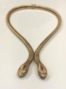 A 9ct gold two-headed snake necklace, elastic body with tongue and groove clasp,