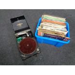 An early 20th century Columbia portable gramophone and a box of LP records including musicals,