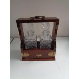 A mahogany and brass two decanter Tantalus with key CONDITION REPORT: This is in