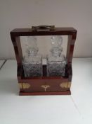 A mahogany and brass two decanter Tantalus with key CONDITION REPORT: This is in