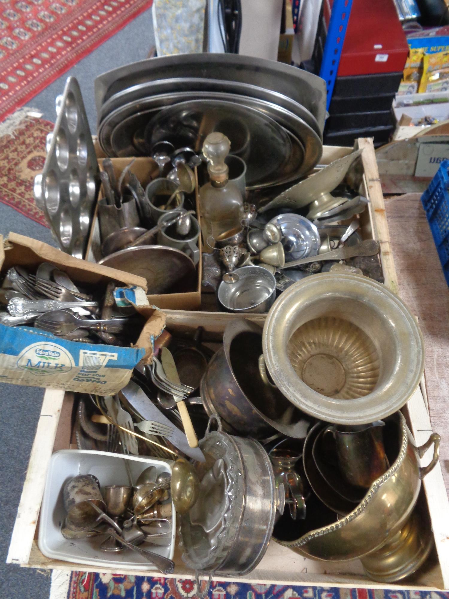 Two crates of 20th century metal ware - serving trays, tankards, cutlery,