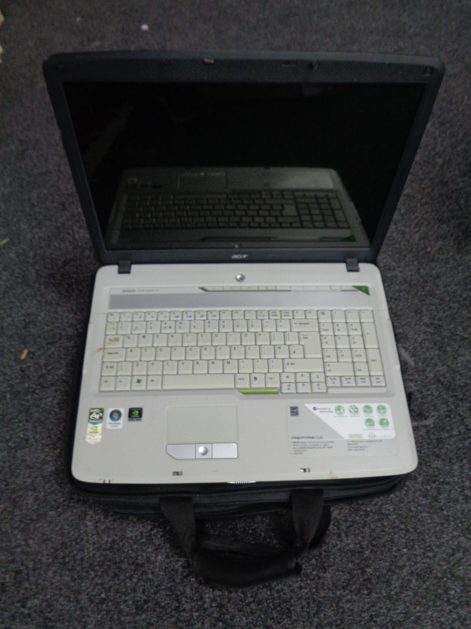 An Acer Aspire 7520 laptop in carry bag