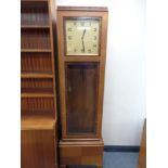 A 20th century Art Deco oak and walnut regulator clock