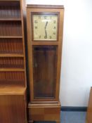 A 20th century Art Deco oak and walnut regulator clock