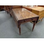 A Victorian mahogany drop leaf table fitted a drawer