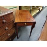 An antique mahogany Pembroke table fitted a drawer