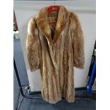 A lady's full length fox fur coat