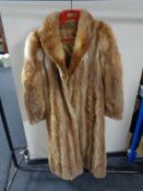 A lady's full length fox fur coat