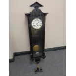 An early 20th century painted cased Vienna style wall clock