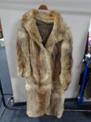 A lady's full length fox fur coat