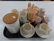 A tray of Hornsea Fleur lidded kitchen jar, six cups and saucers,