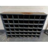 A mid 20th century metal 48-space industrial shelving unit (dimensions 130 cm x 95cm x 25cm deep)