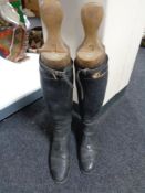 A pair of vintage leather riding boots with Peel & Co wooden boot stretchers