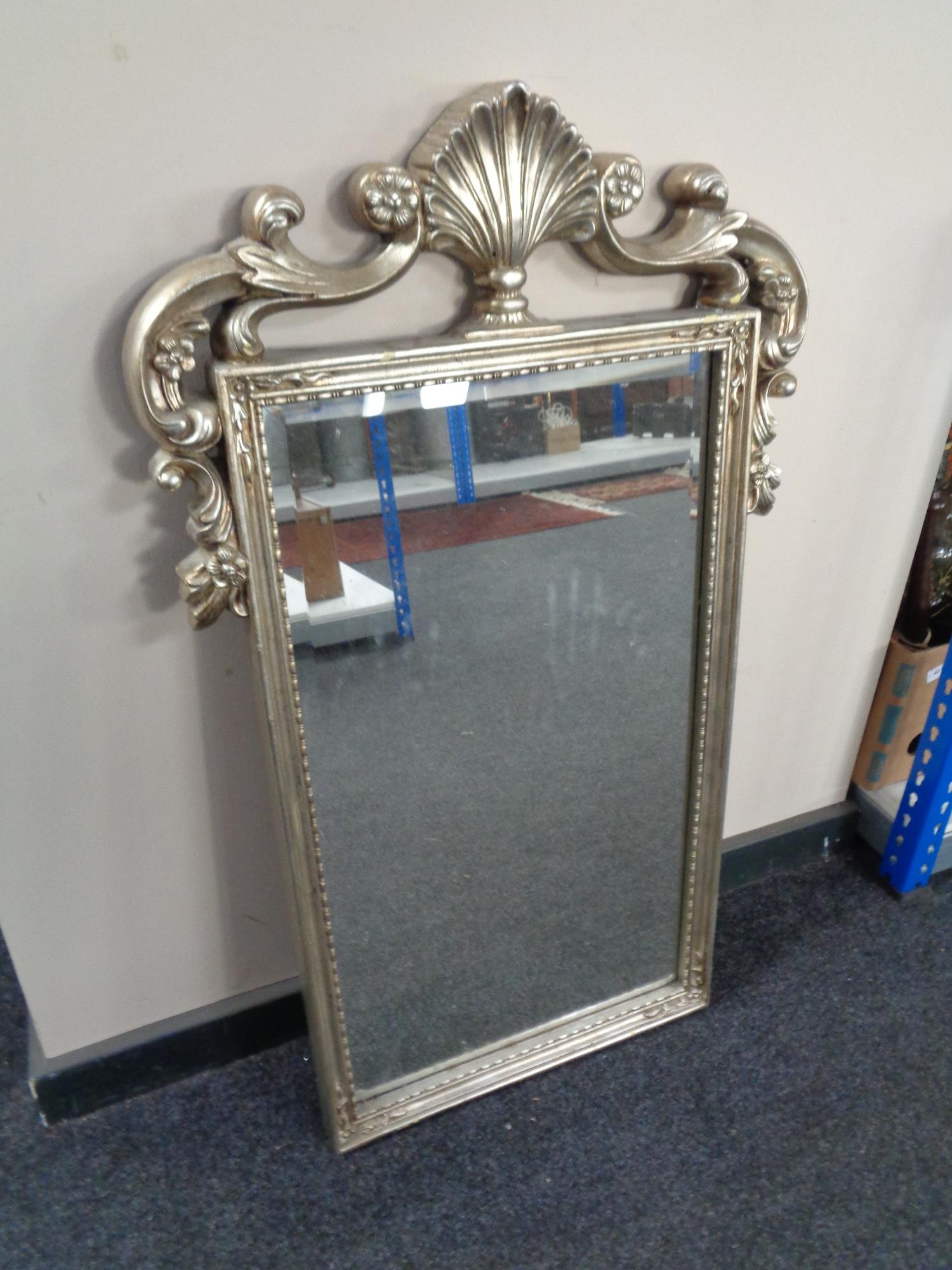 A contemporary silvered framed mirror