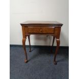 A walnut sewing machine table