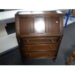 A 20th century oak bureau, height 107 cm, width 76 cm, depth 41 cm.