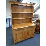 An oak linen fold Welsh dresser