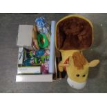 A toddler soft rocking toy together with a box containing new children;