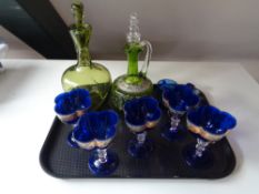 A tray of antique glass ware to include hand painted green glass liqueur decanter together with one
