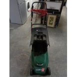 A Qualcast Cobra Quiet 32 electric lawn mower with grass box and lead