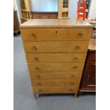 A mid 20th century teak seven drawer chest