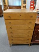 A mid 20th century teak seven drawer chest